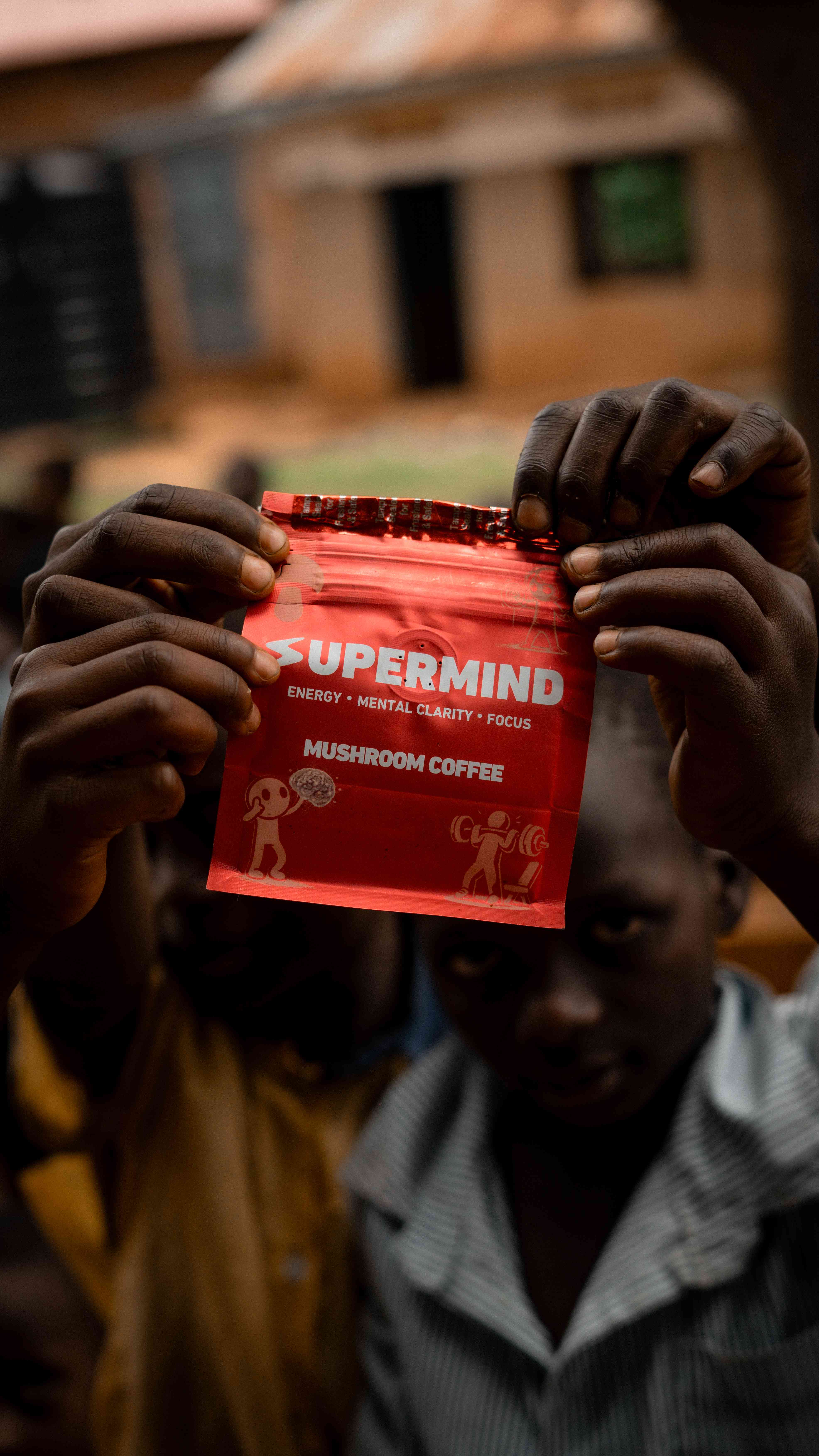 Student holding Supermind coffee package